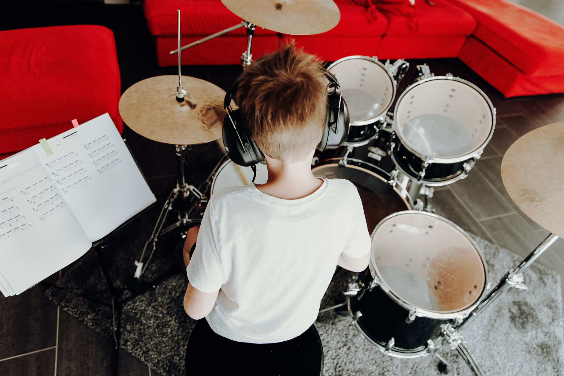 young boy playing the drums