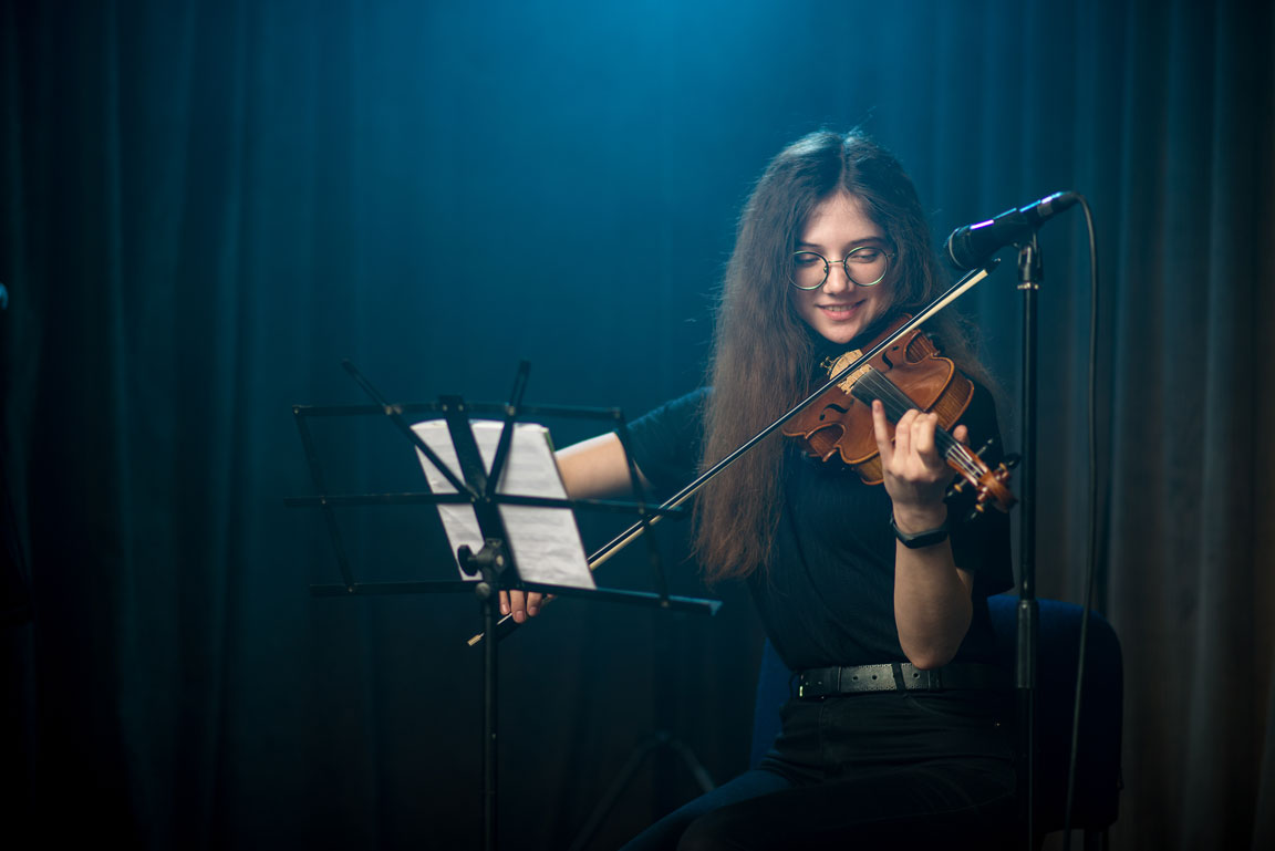 female violinist performing at a music recital