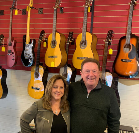 Jimmy and Jackie Osborne inside of their music store