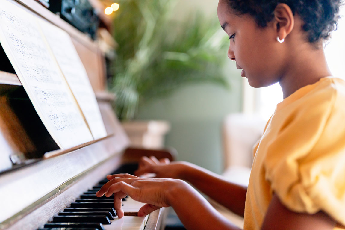 African American girl playing the piano